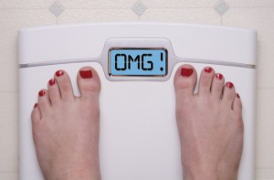 Women on Scale with Weight Set to OMG